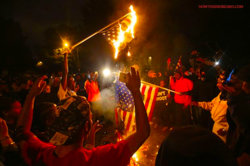 ferguson-protesters-st-louis-burn-american-flags-on-grand-boulevard.jpg
