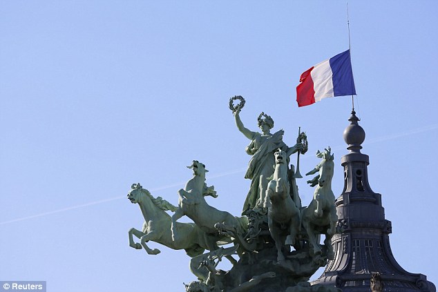 1411747421000_wps_3_The_French_flag_flies_at_.jpg